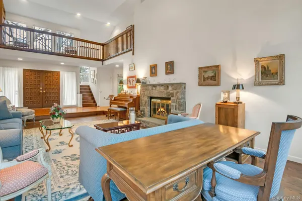 a dining table with chairs and window