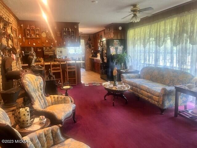 6285 Forsyth Road Macon, GA 31210 - Photo 17 of 24 a living room with furniture and a large window