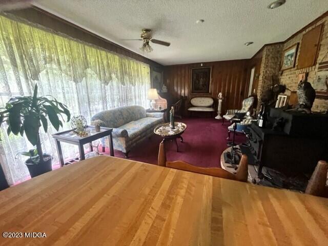 6285 Forsyth Road Macon, GA 31210 - Photo 18 of 24 a room with gym equipment and a large window