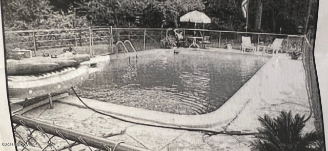 6285 Forsyth Road Macon, GA 31210 - Photo 20 of 24 a view of outdoor space and swimming pool
