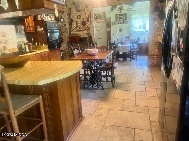 6285 Forsyth Road Macon, GA 31210 - Photo 9 of 24 a dining room with lots of tables and chairs