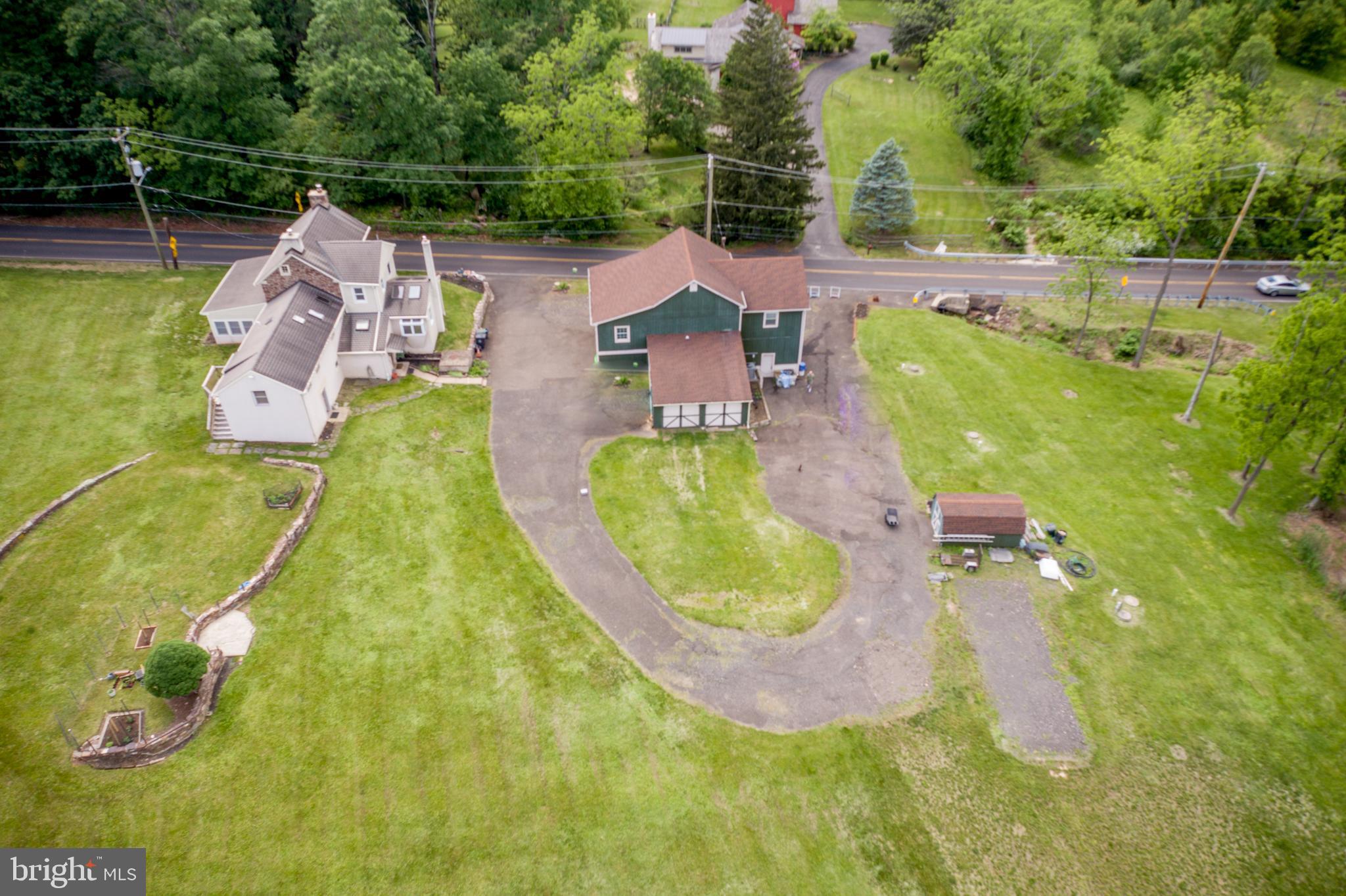 577 Sacketts Ford Road Warminster, PA 18974 - Photo 3 of 5 an aerial view of a house with swimming pool and large trees