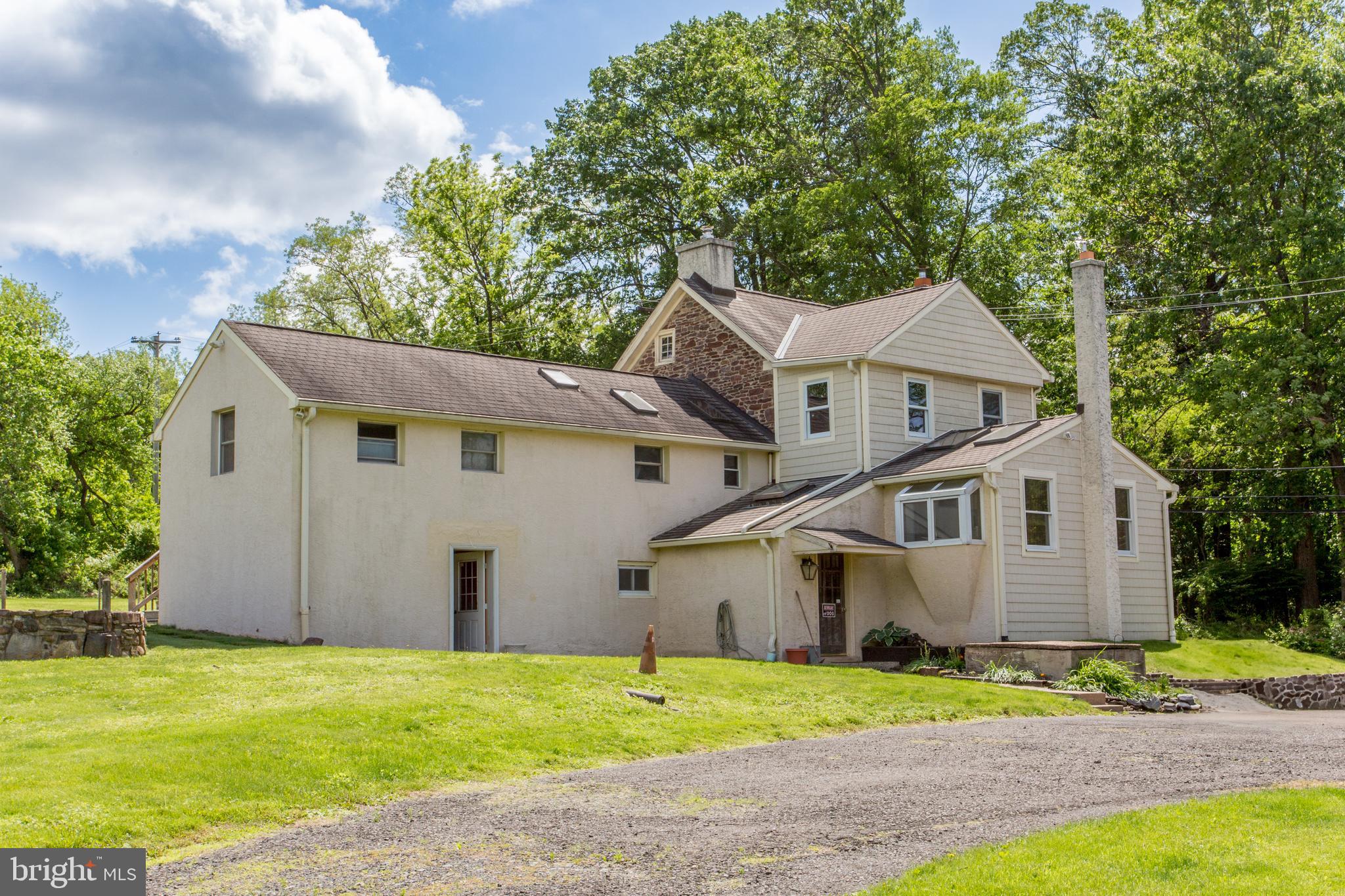 577 Sacketts Ford Road Warminster, PA 18974 - Photo 4 of 5 a view of an house with backyard and bushes