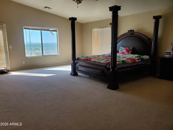a bed room with a bed and a window