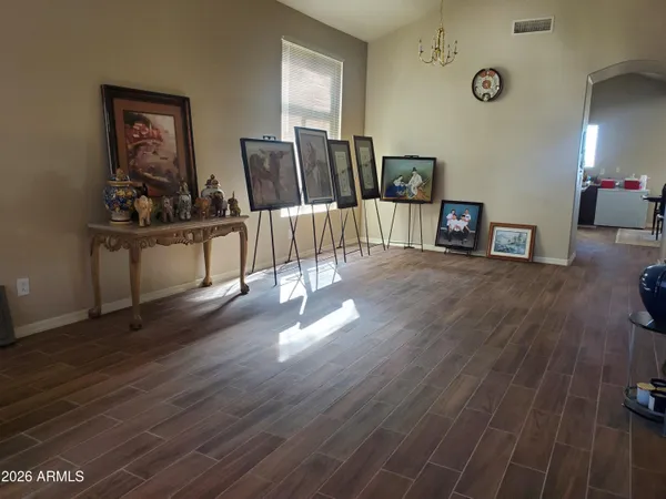 a view of a workspace with furniture and wooden floor