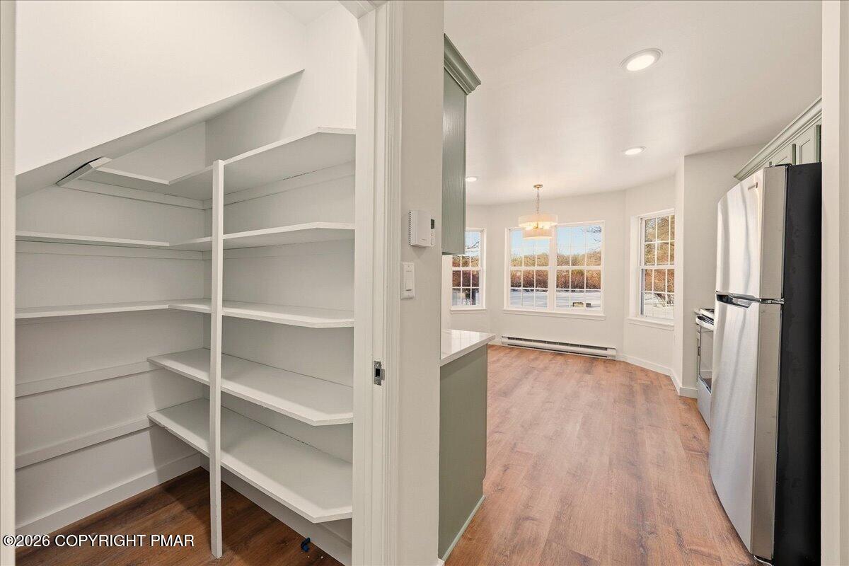 167 Bull Run Long Pond, PA 18334 - Photo 11 of 35 a view of a kitchen with wooden floor and a window