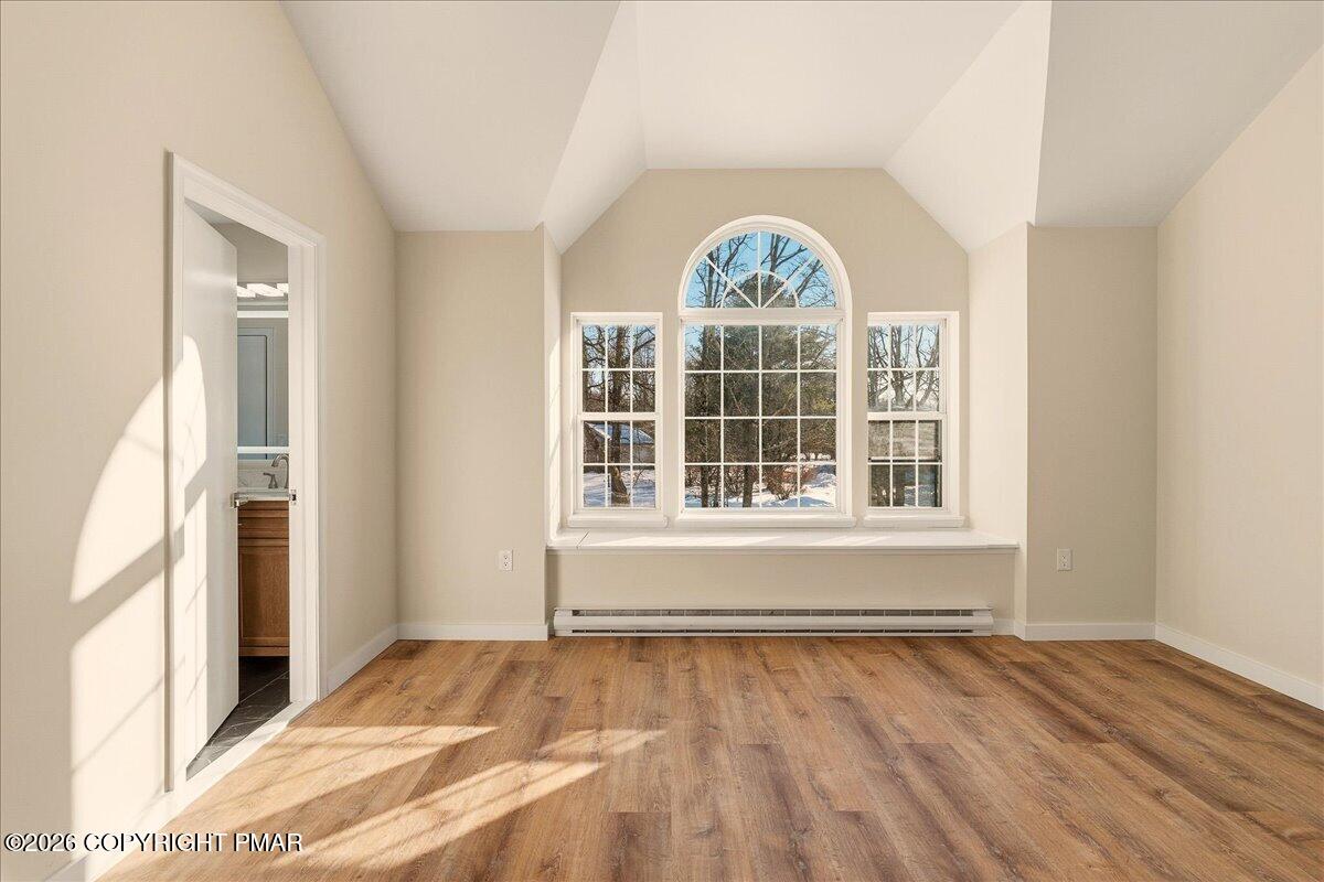 167 Bull Run Long Pond, PA 18334 - Photo 15 of 35 a view of an empty room with wooden floor and a window