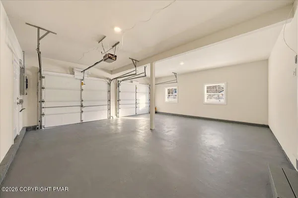 a view of a livingroom with an empty space and a ceiling fan