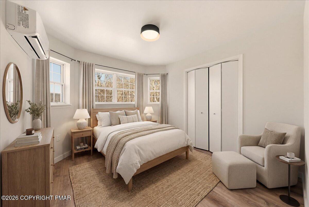 167 Bull Run Long Pond, PA 18334 - Photo 5 of 35 a spacious bedroom with a bed and large windows