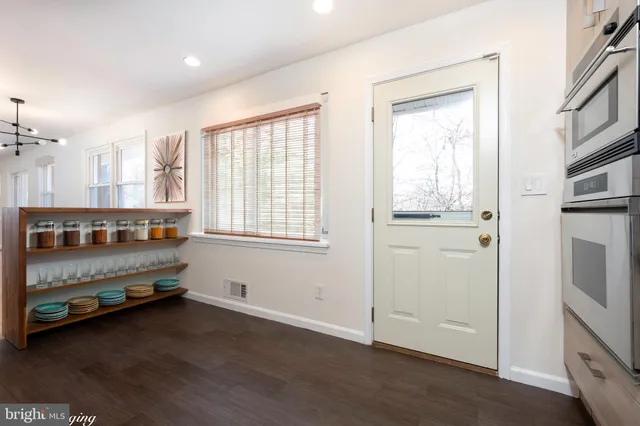 a view of room with window and hardwood floor