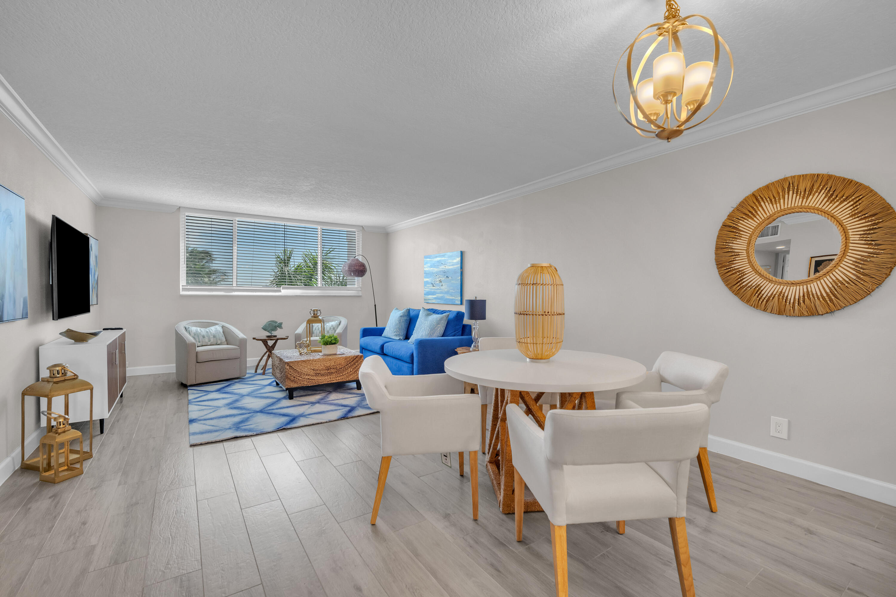 601 North Ocean Boulevard, Unit 503 Boca Raton, FL 33432 - Photo 2 of 7 a living room with furniture and a wooden floor