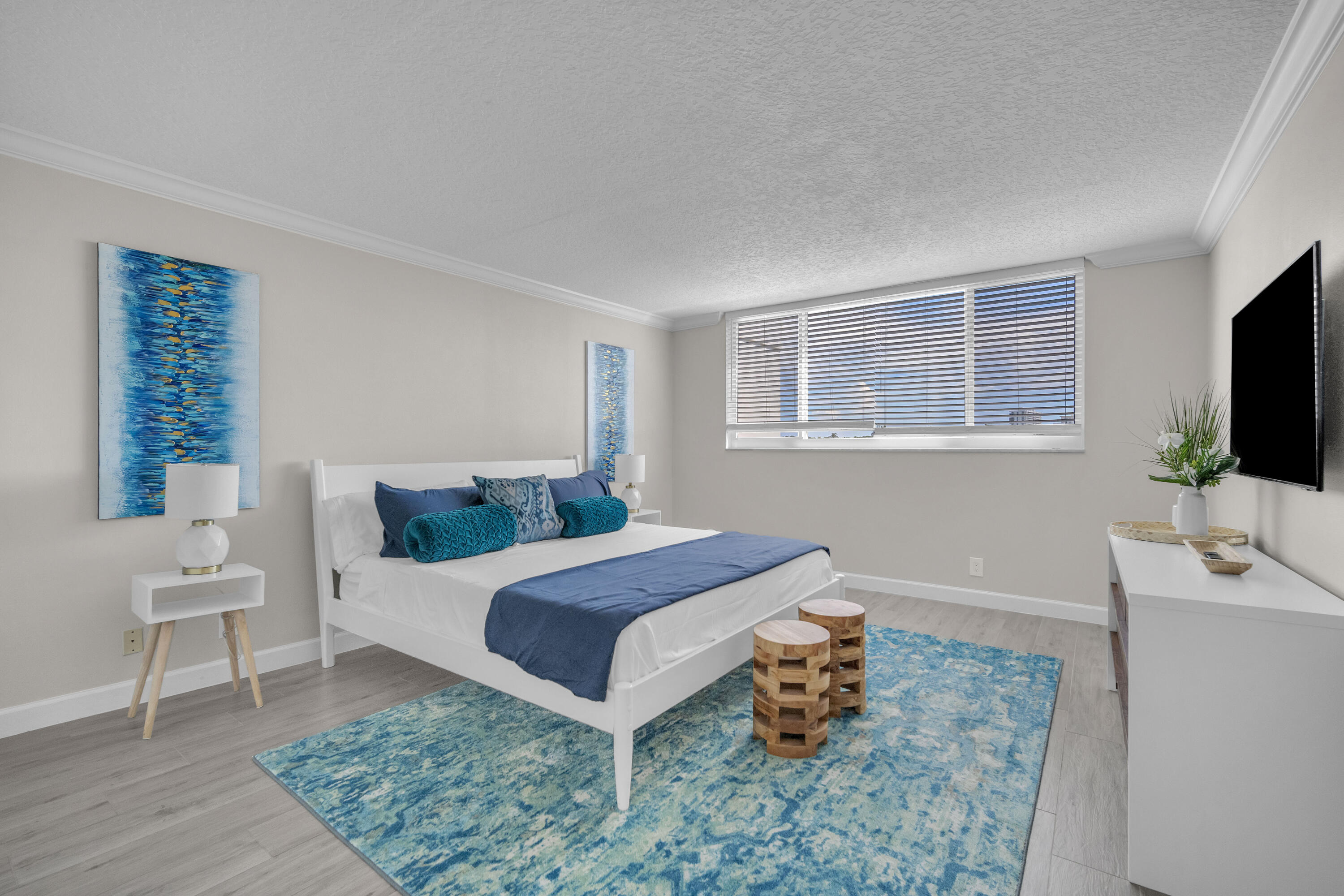 601 North Ocean Boulevard, Unit 503 Boca Raton, FL 33432 - Photo 4 of 7 a bedroom with a bed and a flat screen tv