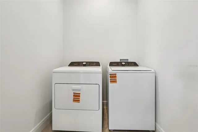a utility room with dryer and washer