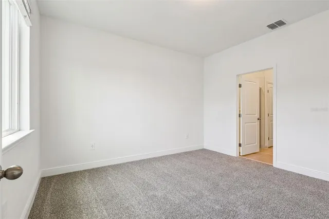 an empty room with windows