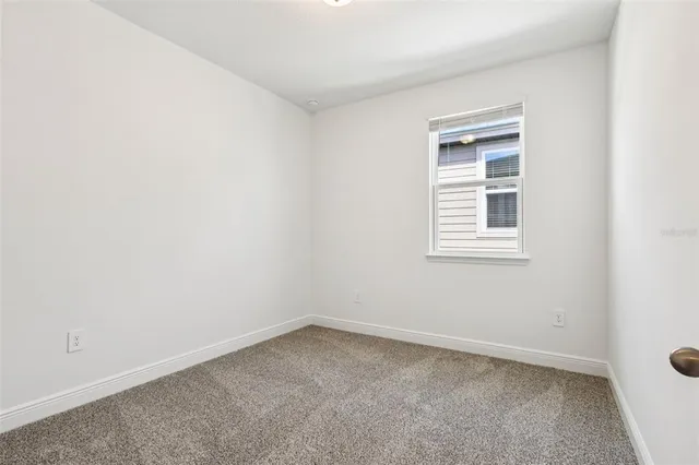 an empty room with closet area