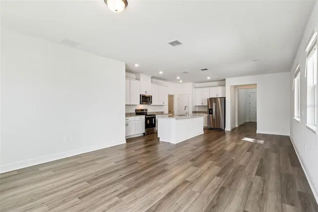 a view of kitchen with wooden floor