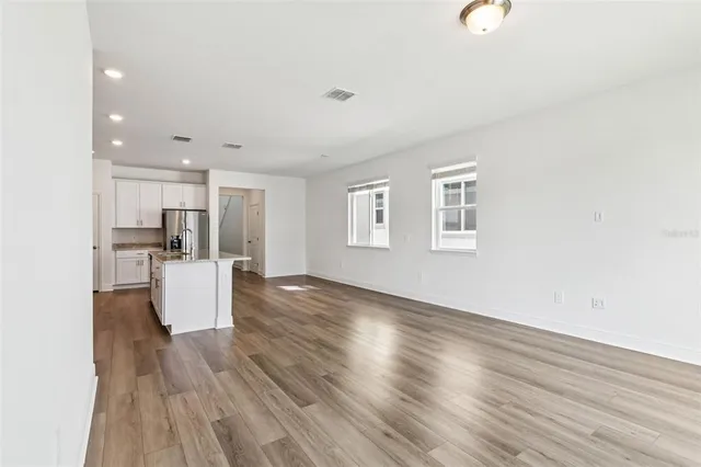 a view of kitchen and wooden floor