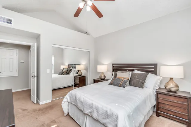 a bedroom with bed and window