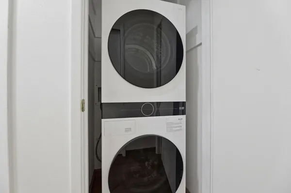 a view of a livingroom with furniture and a window
