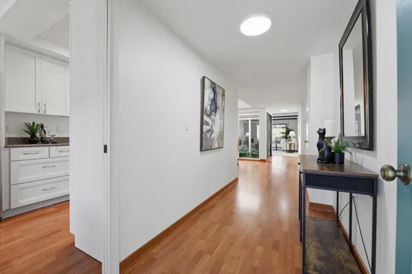 a kitchen with a refrigerator and a sink