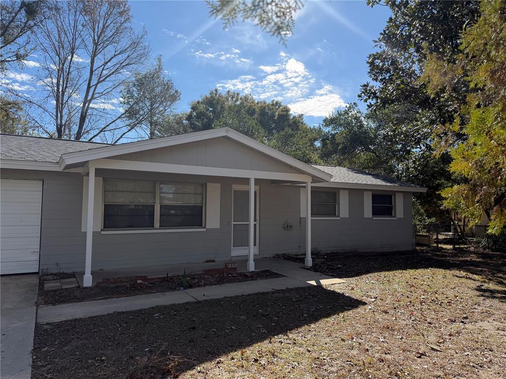 a house with trees in the background