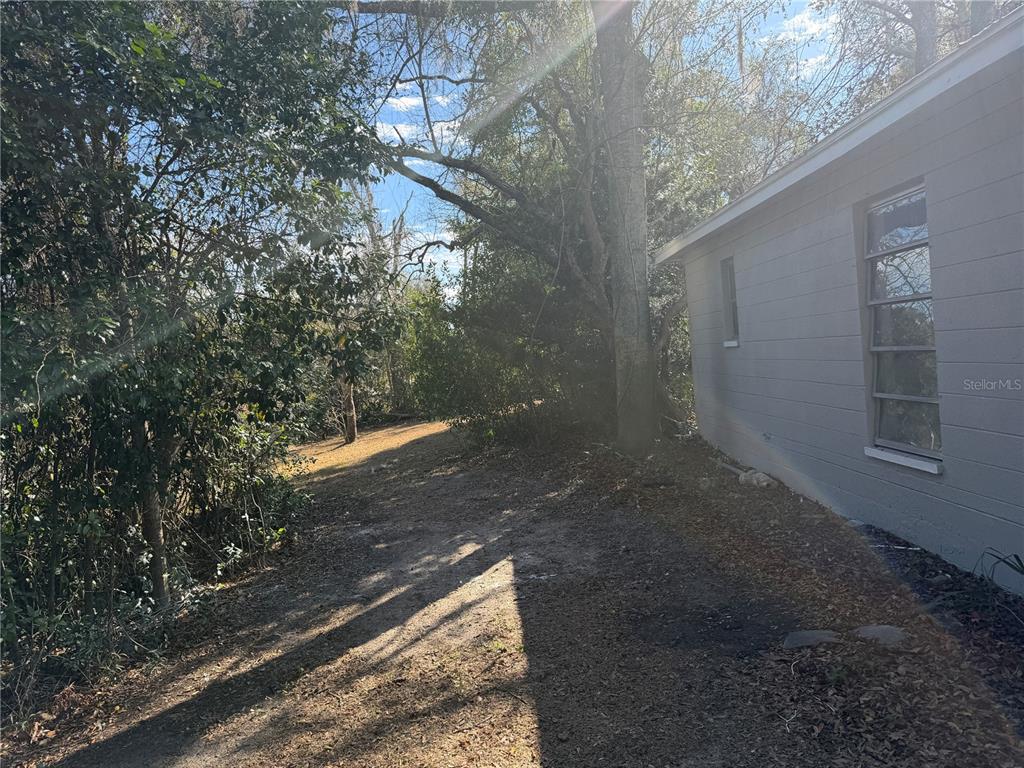 2713 Adams Street West Inverness, FL 34453 - Photo 3 of 11 a view of a yard with trees