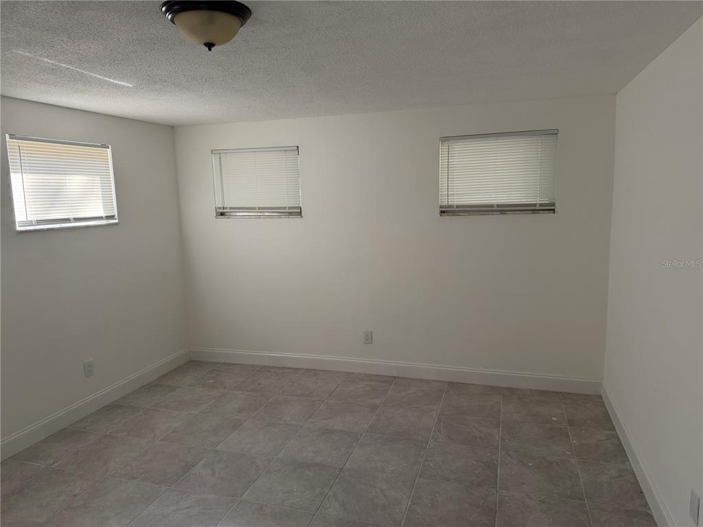 2713 Adams Street West Inverness, FL 34453 - Photo 4 of 11 an empty room with a window