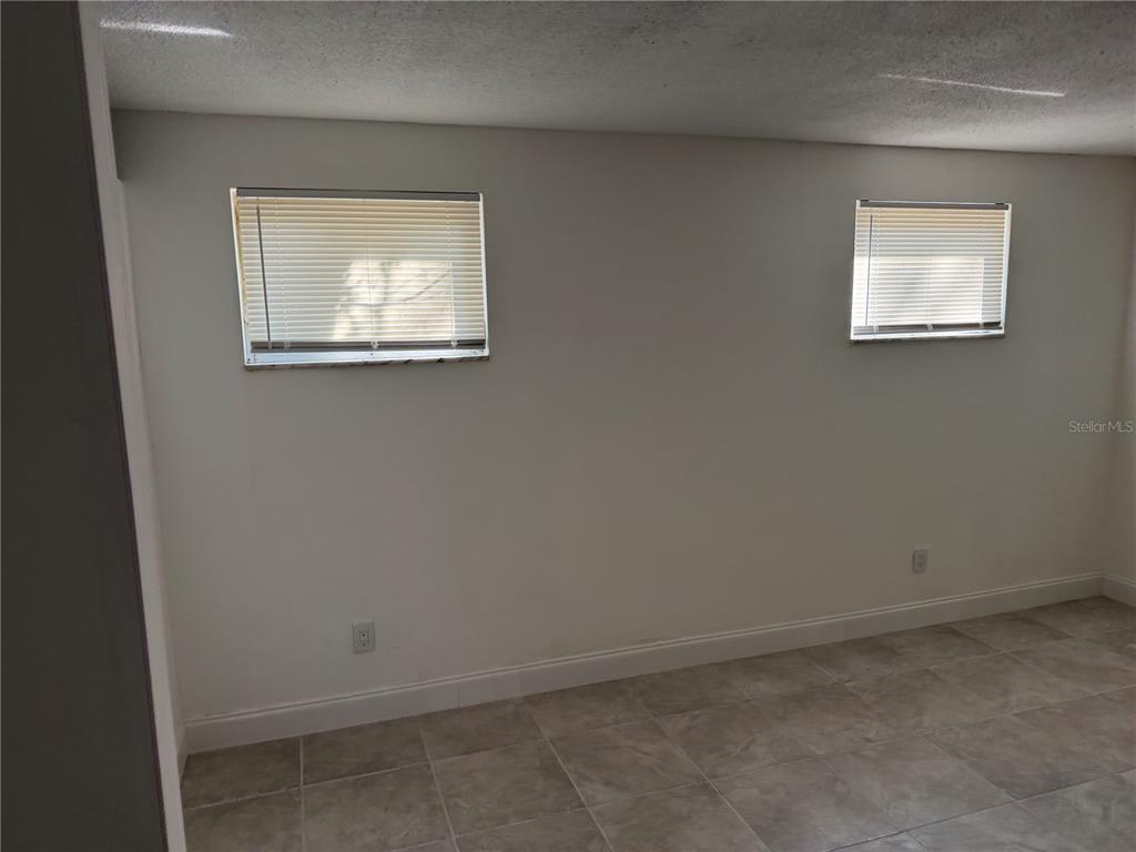 2713 Adams Street West Inverness, FL 34453 - Photo 5 of 11 an empty room with a window
