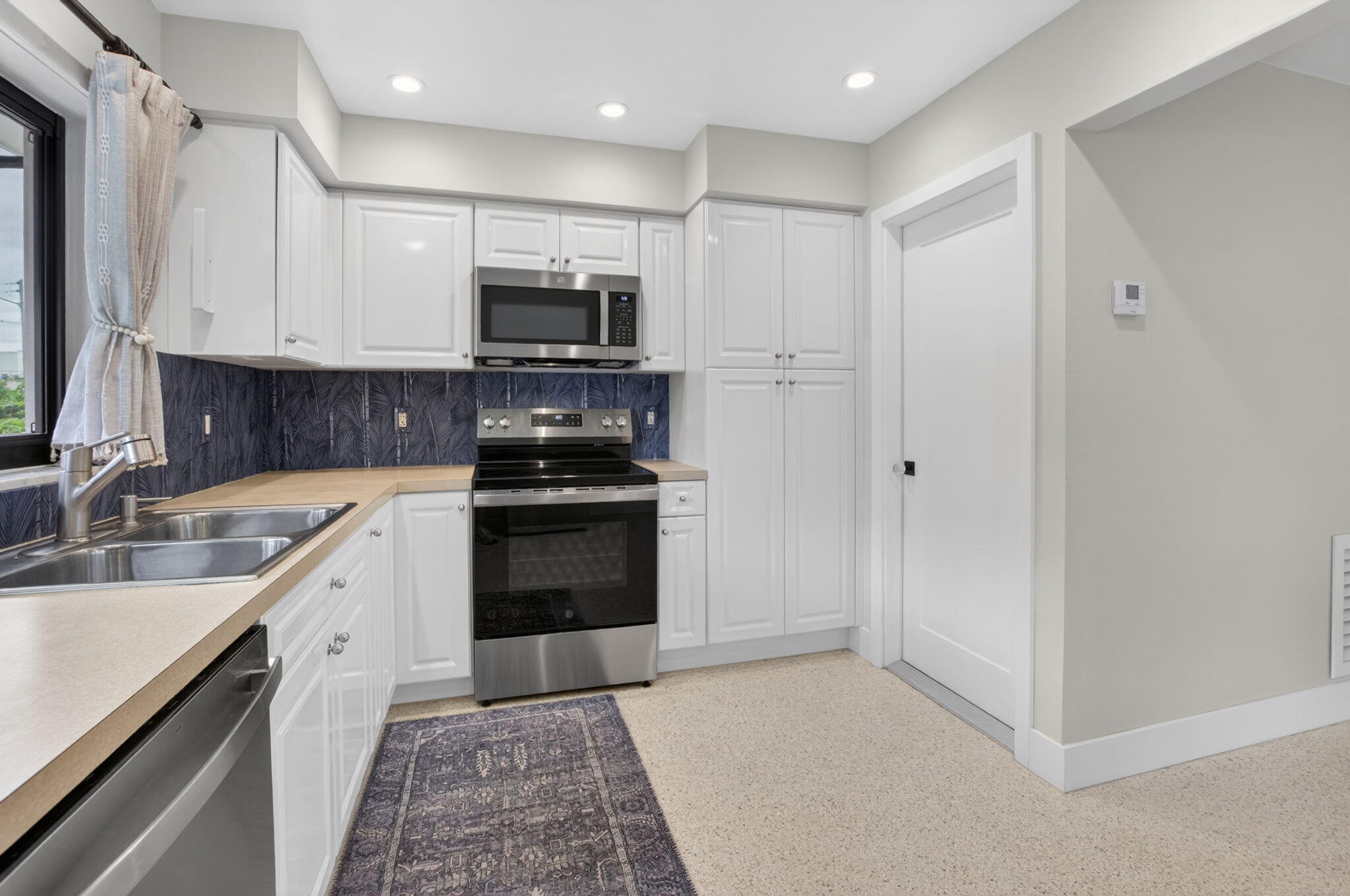 450 Southwest 12th Terrace Boca Raton, FL 33486 - Photo 14 of 55 Door to Laundry and Garage
