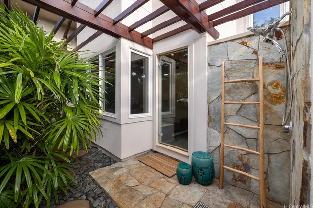 a glass door with a plant in front of it