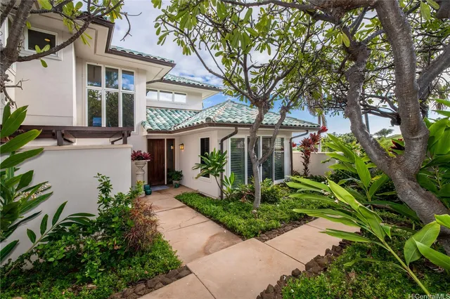 front view of a house with a garden