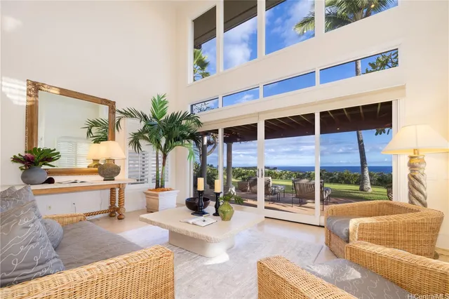 a view of a swimming pool with a couches in a patio