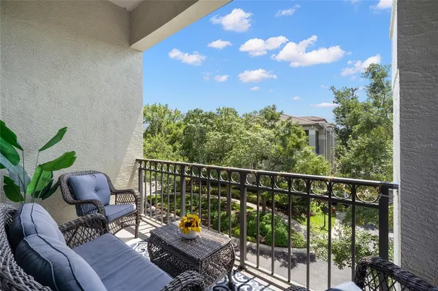 a view of a balcony with furniture
