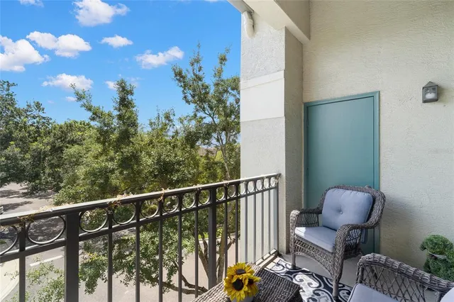 a view of a balcony with chairs