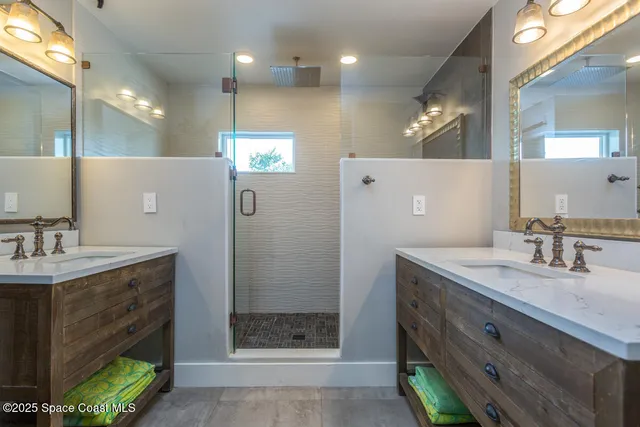 a bathroom with a granite countertop toilet and a sink