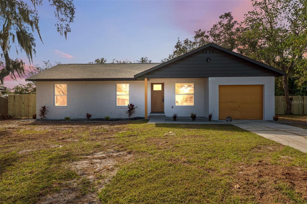 606 Kings Lane Southwest Winter Haven, FL 33880 - Photo 1 of 50 a house view with a outdoor space