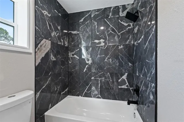 a bathroom with a sink and toilet