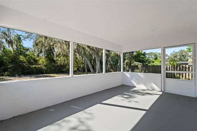 a view of a living room and floor to ceiling window