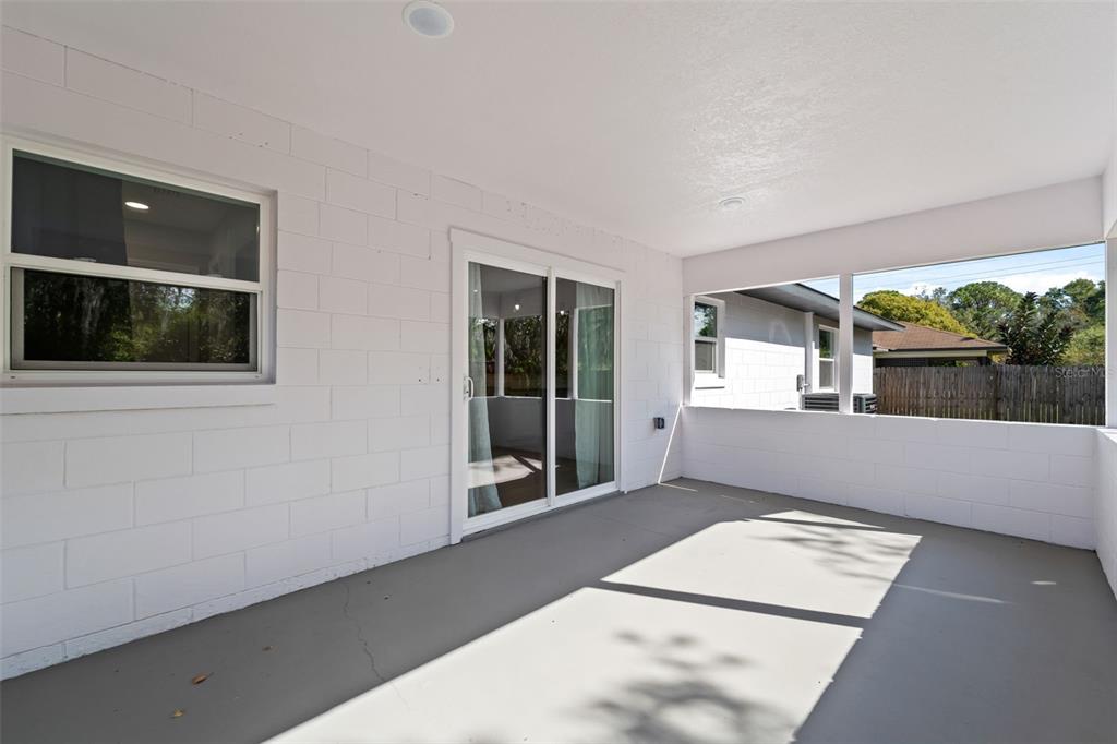 606 Kings Lane Southwest Winter Haven, FL 33880 - Photo 26 of 50 a view of an empty room with a window and wooden floor