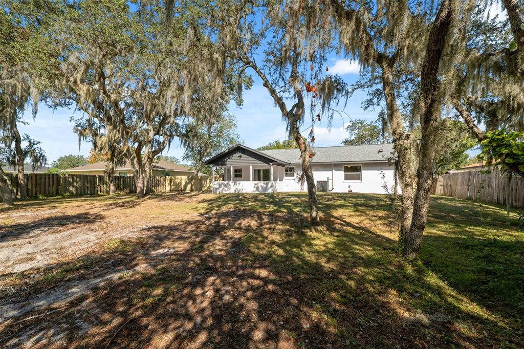 606 Kings Lane Southwest Winter Haven, FL 33880 - Photo 30 of 50 a front view of a house with a yard