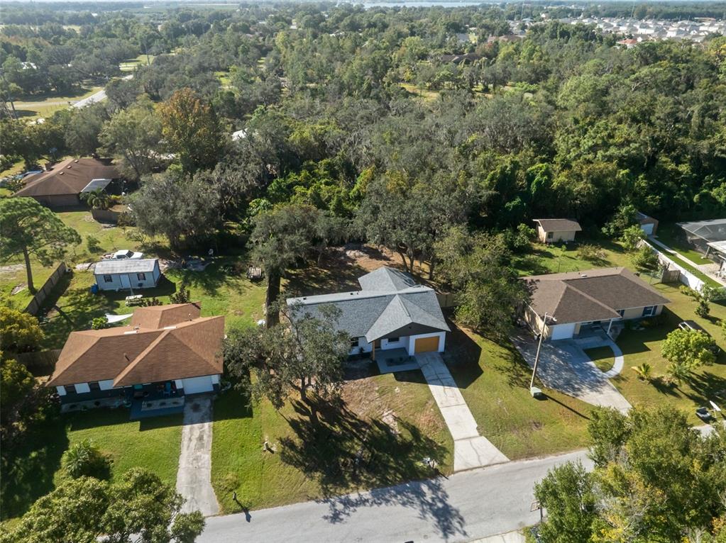 606 Kings Lane Southwest Winter Haven, FL 33880 - Photo 37 of 50 an aerial view of house with yard swimming pool and outdoor seating