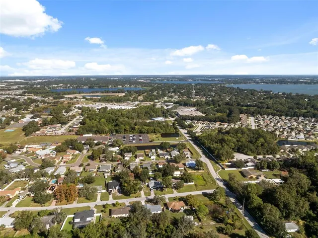 an aerial view of residential building with city view