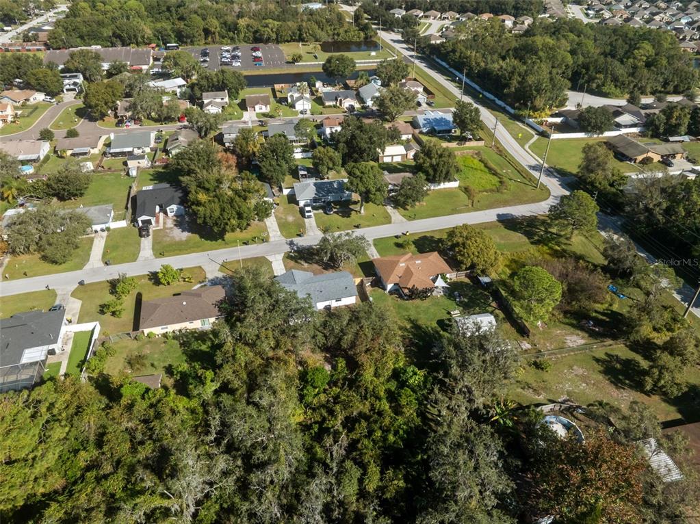 606 Kings Lane Southwest Winter Haven, FL 33880 - Photo 41 of 50 an aerial view of residential houses with outdoor space and street view