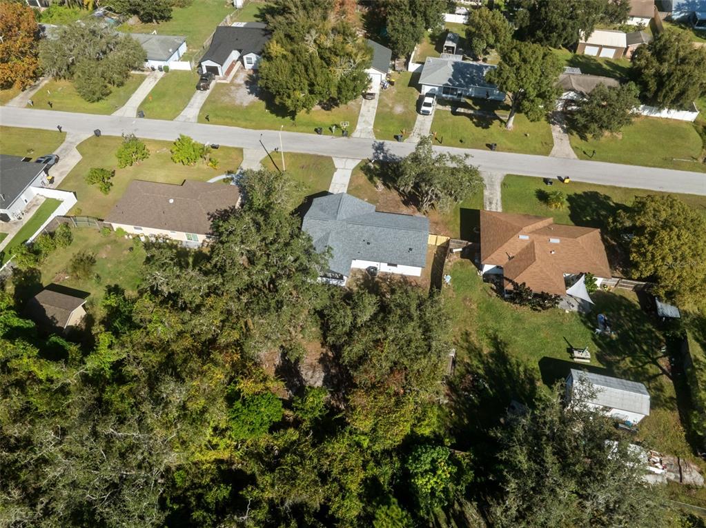 606 Kings Lane Southwest Winter Haven, FL 33880 - Photo 43 of 50 an aerial view of residential houses with outdoor space