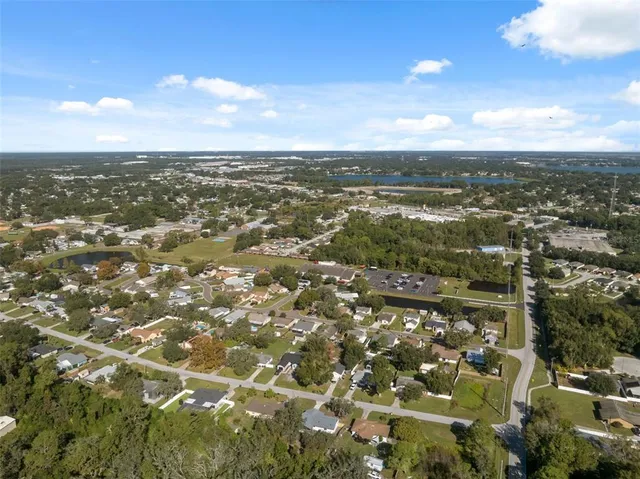 an aerial view of residential building with green space