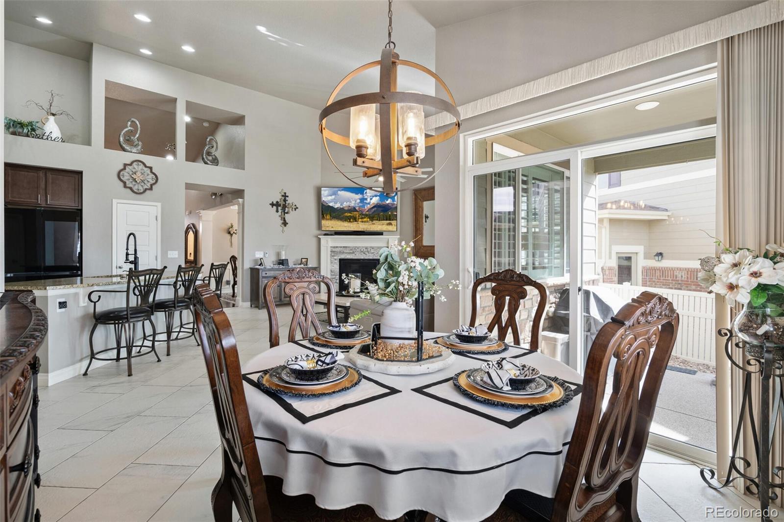 8841 Peakview Avenue Firestone, CO 80504 - Photo 12 of 40 a dining room with furniture a chandelier and window