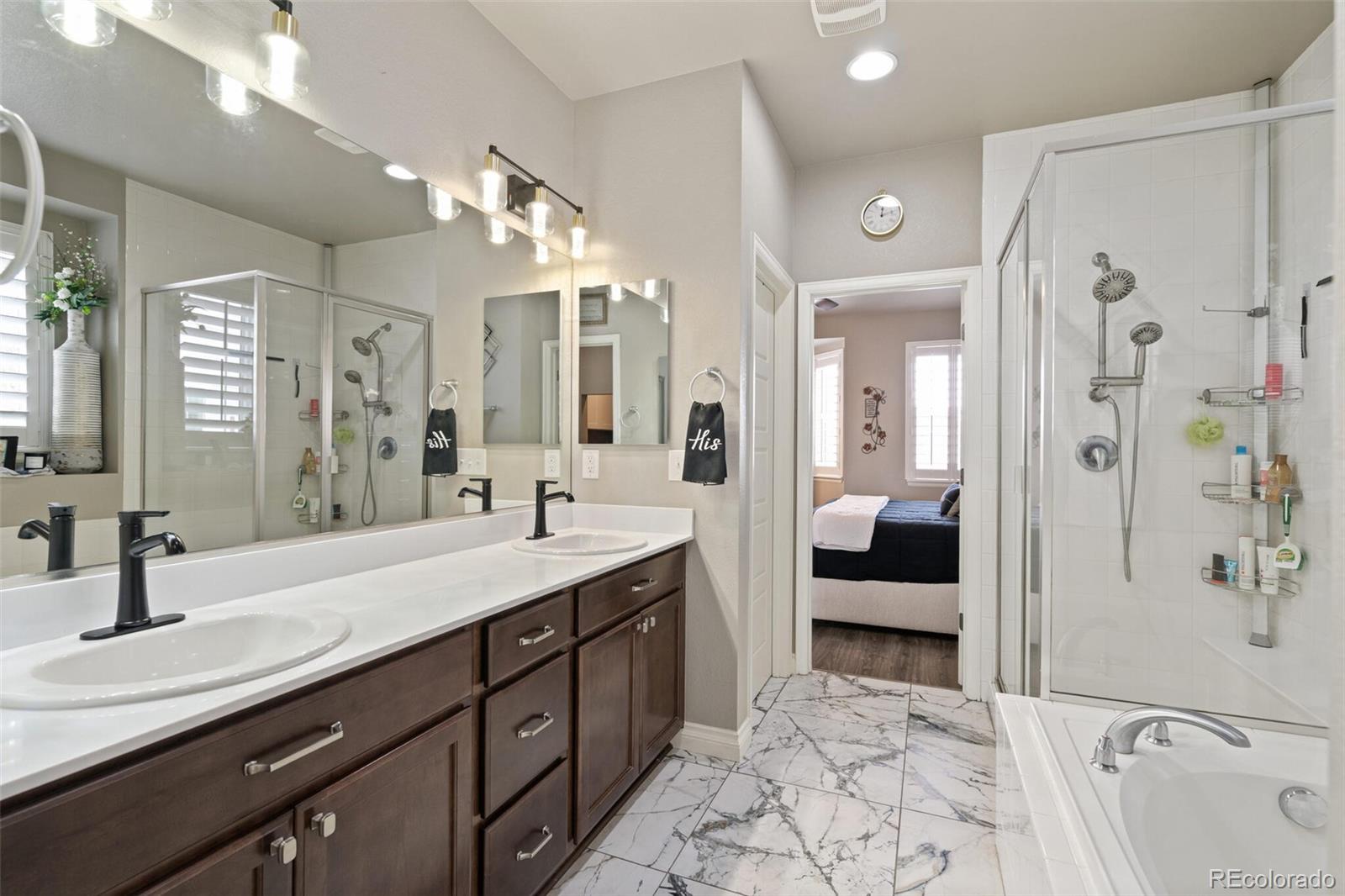 8841 Peakview Avenue Firestone, CO 80504 - Photo 18 of 40 a spacious bathroom with a sink double vanity and shower