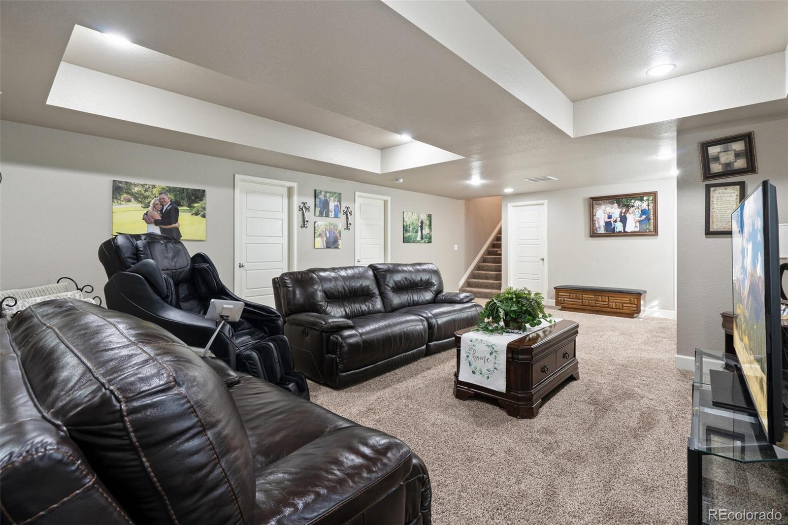 8841 Peakview Avenue Firestone, CO 80504 - Photo 25 of 40 a living room with furniture and a couch