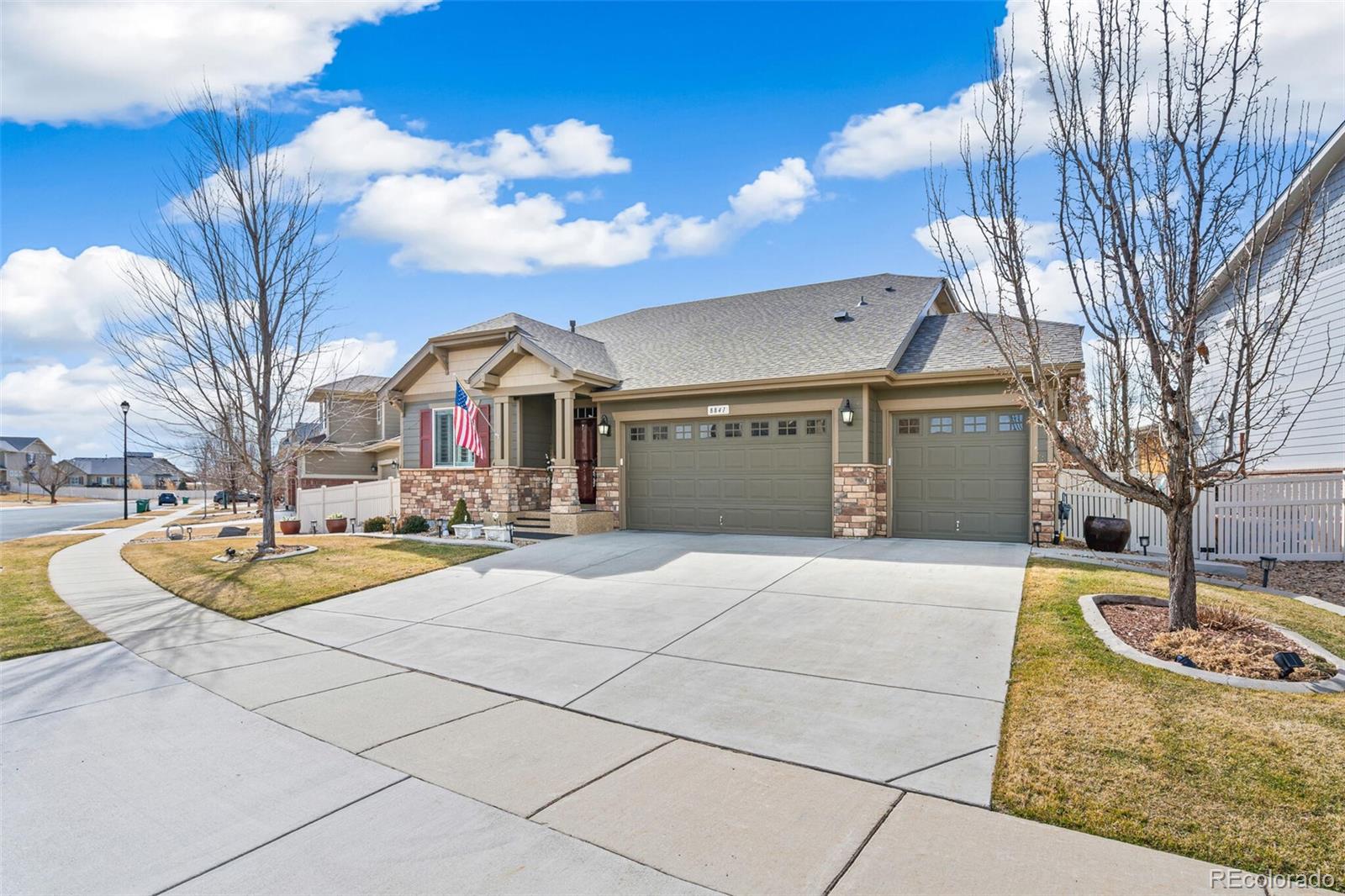 8841 Peakview Avenue Firestone, CO 80504 - Photo 38 of 40 a front view of a house with basket ball court and outdoor seating