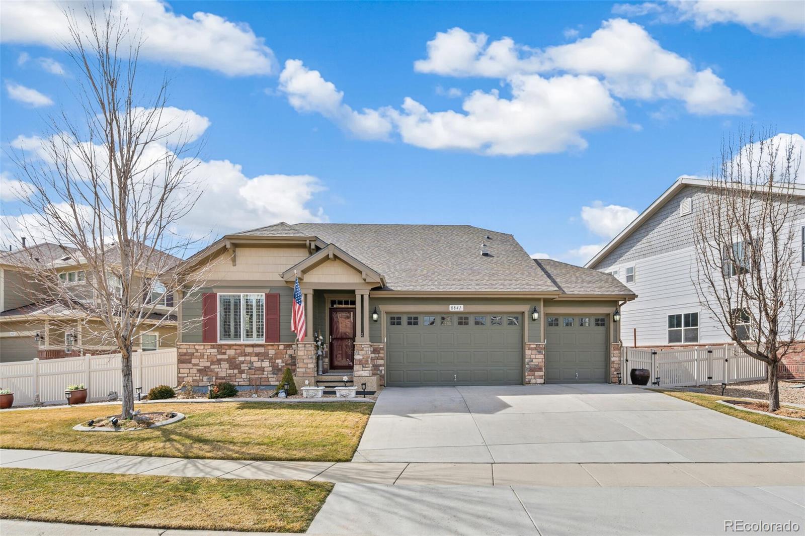 8841 Peakview Avenue Firestone, CO 80504 - Photo 39 of 40 a front view of a house with a garden
